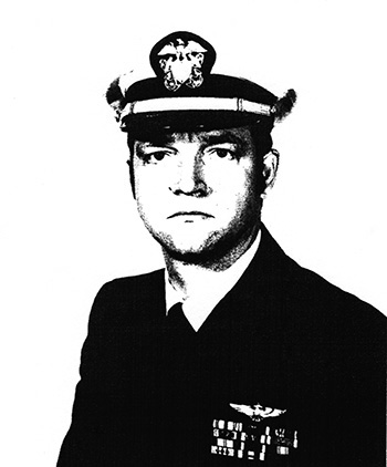 Man in a decorated U.S. Navy suit and hat.