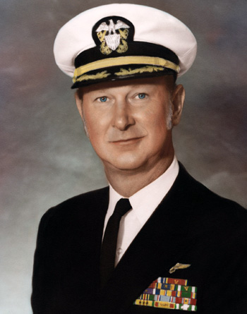 Man in a decorated U.S. Navy suit and cap.