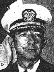 Close up photo of a man in a U.S. Navy suit and cap.