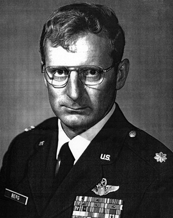 Man in glasses wearing a decorated U.S. Air Force suit.