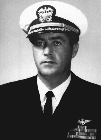 Man in a decorated U.S. Navy suit and hat.