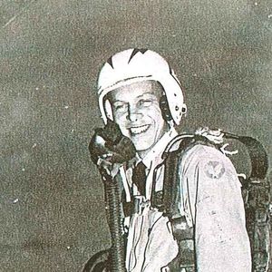 Man in a utility air force suit and helmet. 