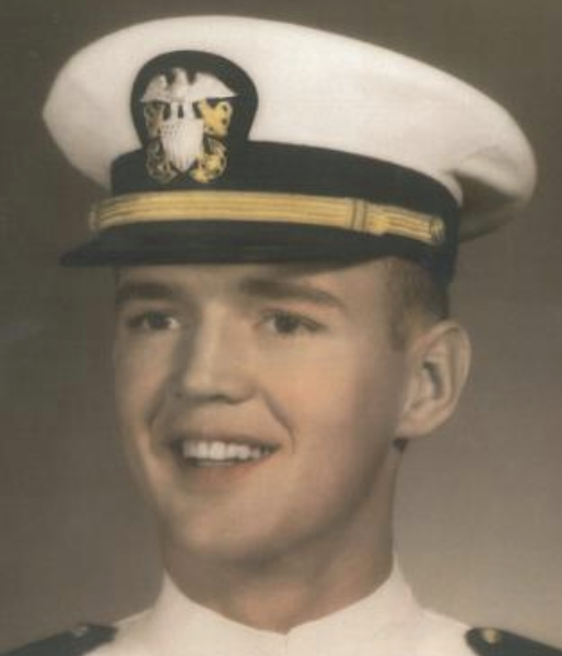 Man in a white military suit and cap.