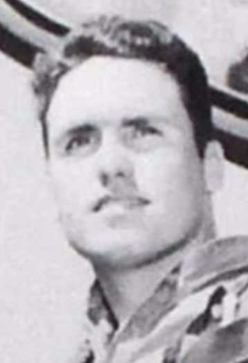 Close up of a man in a collared shirt.