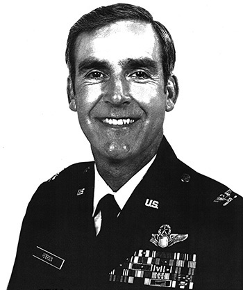 Man in a decorated military suit.