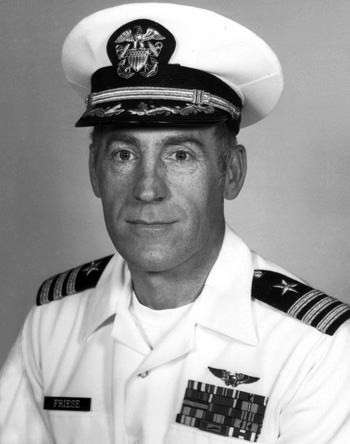 Man in a decorated U.S. Navy suit and cap.