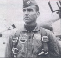 Man in a military utility uniform and hat.